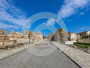 Entrance in the old town of Nessebar in Bulgaria with old ruins