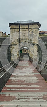 entrance over a wooden bridge to the castle courtyard