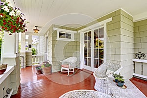 Entrance porch with wicker chairs and glass door