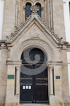Entrance portal in carved stone with pantocrator in Our Lady of help church, Espinho PORTUGAL photo