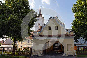 The entrance portal of the historical Church-fortress in the city of Harman. Transylvania. Romania