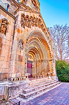 The entrance portal ot Jak Chapel with carved stone sculptures and geometric ornament, Budapest, Hungary