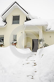 Entrance of a private house under snow in winter