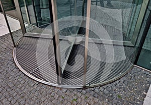 entrance revolving door with built-in mat. stainless steel frame.