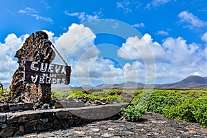 Entrance sign in front of Cueva de los Verdes, an amazing lava tube and tourist attraction