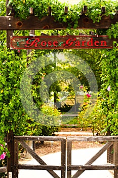 Entrance sign stating Rose Garden