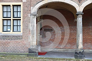 Entrance and sign of the Supreme court Raad van State at the government center Binnenhof in The Hague