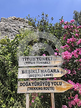 Entrance sign of Titus tunnel and cave in Hatay, Turkey in Turkish and English photo