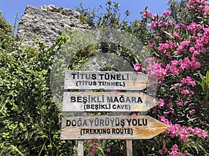 Entrance sign of Titus tunnel and cave in Hatay, Turkey in Turkish and English photo