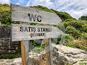 Entrance sign of toilet and kiosk in Turkish with English translation