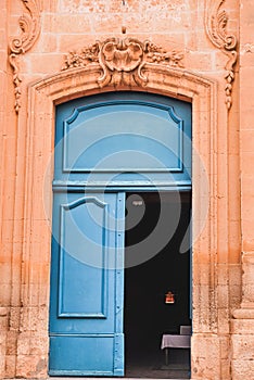 Entrance to a 1300`s century, chaple with blue doors