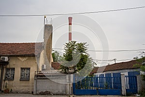 Entrance to an Abandoned factory and warehouse with its distinctive chimney in Eastern Europe, Belgrade Serbia, former Yugoslavia