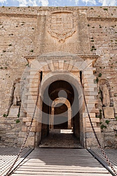 Entrance to Almudaina Castle in Eivissa, Ibiza, featuring drawbridge and chains