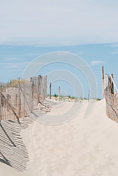 Entrance to a beach with wood fence