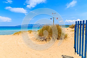 Entrance to beautiful sandy Santa Maria beach with turquoise sea water, Paros island, Greece