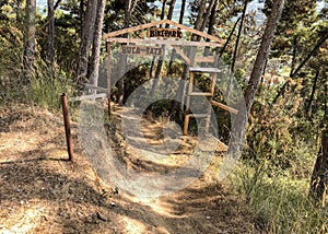 Entrance to the Buca delle Fate Archaeological Naturalistic Park in Pian di Mommio, Italy