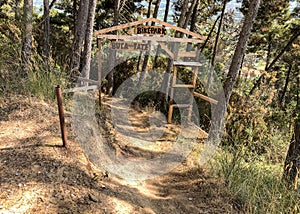 Entrance to the Buca delle Fate Archaeological Naturalistic Park in Pian di Mommio, Italy photo