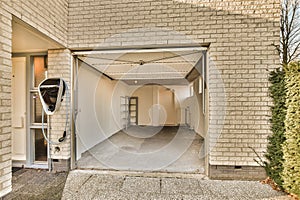 the entrance to a building with an open garage door