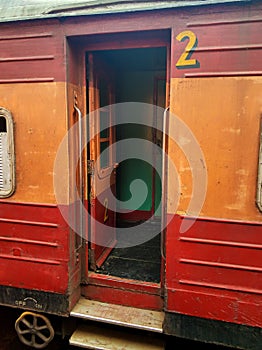 Entrance to the carriage of a passenger train in Sri Lanka