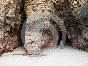 Entrance to a cave in As Catedrais beach, Galicia, Spain. photo