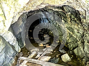 Entrance to a cave in an old industrial excavation