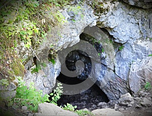 The entrance to the cave . Olenyi Ruchy is a natural park in the Sverdlovsk Region on the territory of the Nizhneserginsky Municip
