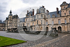 Entrance to the Chateau de Fontainebleau, Paris photo