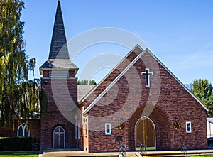 Brick Church With Cross And Steeple