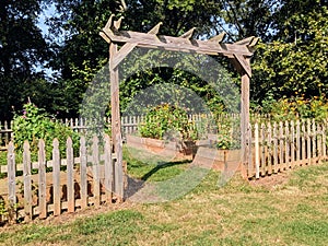 Entrance to community garden with wood fence