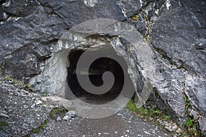 Entrance to dark cave photo