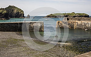 Entrance to harbour at Mullion Cove in Cornwall in England photo