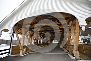 Entrance to historic white covered bridge, Stark, New Hampshire.