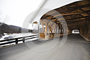 Entrance to historic white covered bridge, Stark, New Hampshire.