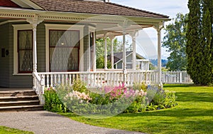 Entrance to a home through a beautiful garden with colorful flowers. Plants and flowers in in a garden