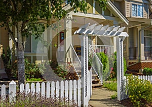 Entrance to a home through a beautiful garden with colorful flowers. Plants and flowers in in a garden