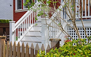 Entrance to a home through a beautiful garden with flowers. Plants and flowers by entrance of a house. Garden design