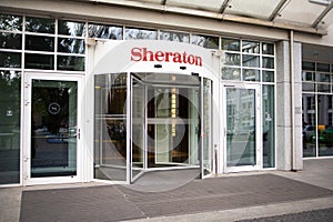 Entrance to the hotel Sheraton with brands sign