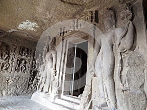 Entrance to inner shrine of Aurangabad Cave 2, attended by Bodhisattva Padmapani, in middle of circumambulatory path, India