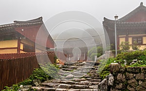 Entrance to Korean Buddhistic Temple Daeseongam, Great Saint Hermitage, near Beomeosa on a foggy day. Located in Geumjeong, Busan