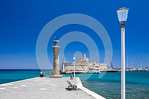 Entrance to Mandraki harbor and marina. Hirsch and Hirschkuh, Elafos and Elafina, bronze statues of deer and stags in the place of