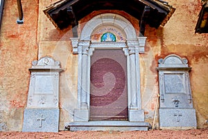 The entrance to the medieval San Maurizio Church in Lugano, Switzerland photo