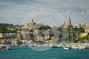 Entrance to the Mgarr port on the island of Gozo with visible ma