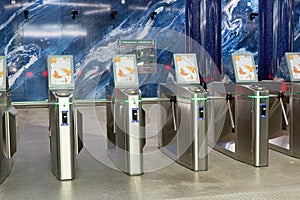 Entrance to office with stainless steel turnstiles