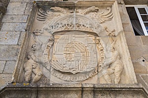 Entrance to the Parador Hostal de los Reyes Catolicos in Plaza del Obradoiro, Santiago de Compostela, Spain photo