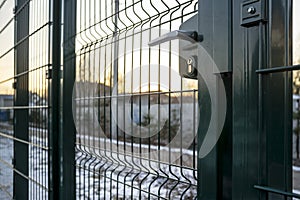 Entrance to the playground of fence and the wicket of the welded wire mesh green