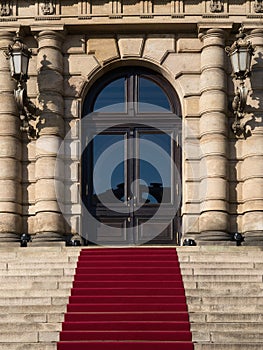 Entrance to the Rudolfinum, stairs, red carpet and closed doors, Prague, Czech Republic