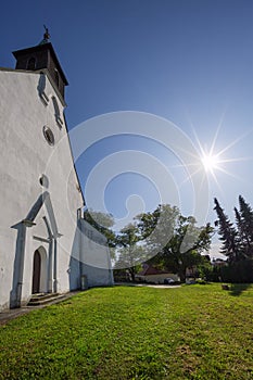 Saint Nicholas church at Sliac with sun