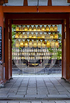 Entrance to shinto shrine with rows colourful paper lanterns, ky