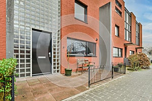 Entrance to a small residential brick house