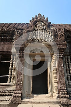 Entrance to temple ruins with detail mural and bas relief in ancient angkor wat, hindu culture and religon in history